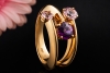 Designer Ring mit 3 violett und rosafarbenen Granaten in 750er Gelbgold 