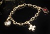 Cartier Spartacus Bettelarmband mit Charms Love CC Kreuz Würfel 750er Gold 