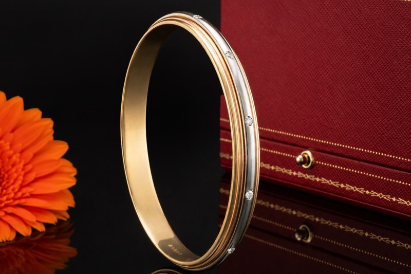 Cartier Armreif Trinity Saturn Drehbar mit Diamanten 750er Gold Tricolor 