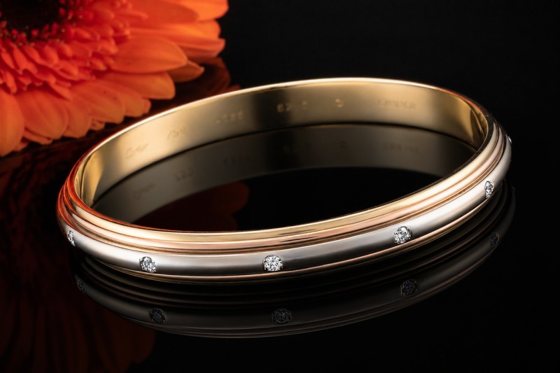 Cartier Armreif Trinity Saturn Drehbar mit Diamanten 750er Gold Tricolor 