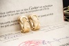 Cartier Ohrringe C de Cartier Clip Ohrstecker geflochten in Gelbgold 750 