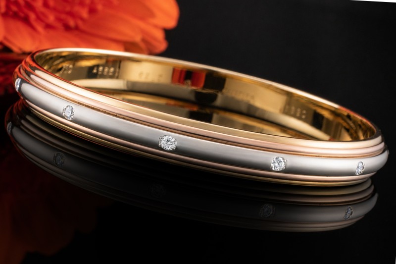Cartier Armreif Trinity Saturn Drehbar mit Diamanten 750er Gold Tricolor 