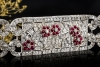 Antikes breites Armband mit Rubin Blumen und Diamanten in 950er Platin 