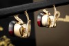 Pomellato Ohrringe Ohrstecker Nudo Classic mit Granat in 750er Gelbgold 