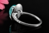 Ring mit Paraiba Turmalin Cabochon 5 Ct. und Diamanten in 750er Weißgold 